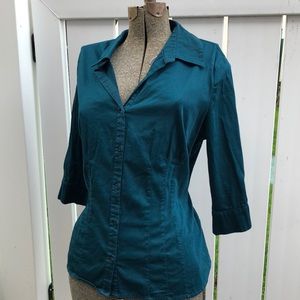 Plus size woman’s button down blouse in dark teal